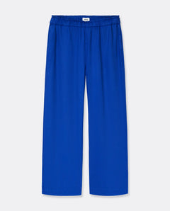 Pantalon femme en Tencel bleu profond, tissu fluide et léger, taille élastiquée, coupe droite ample pour un confort idéal adapté à toutes les morphologies.