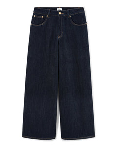 Jean large en denim bleu foncé 100 % coton avec une coupe droite ajustée, conçu pour s’adapter parfaitement à toutes les morphologies féminines.